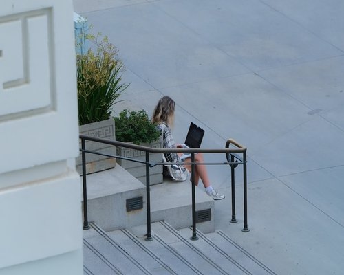 Woman taking a break from computer work outdoors
